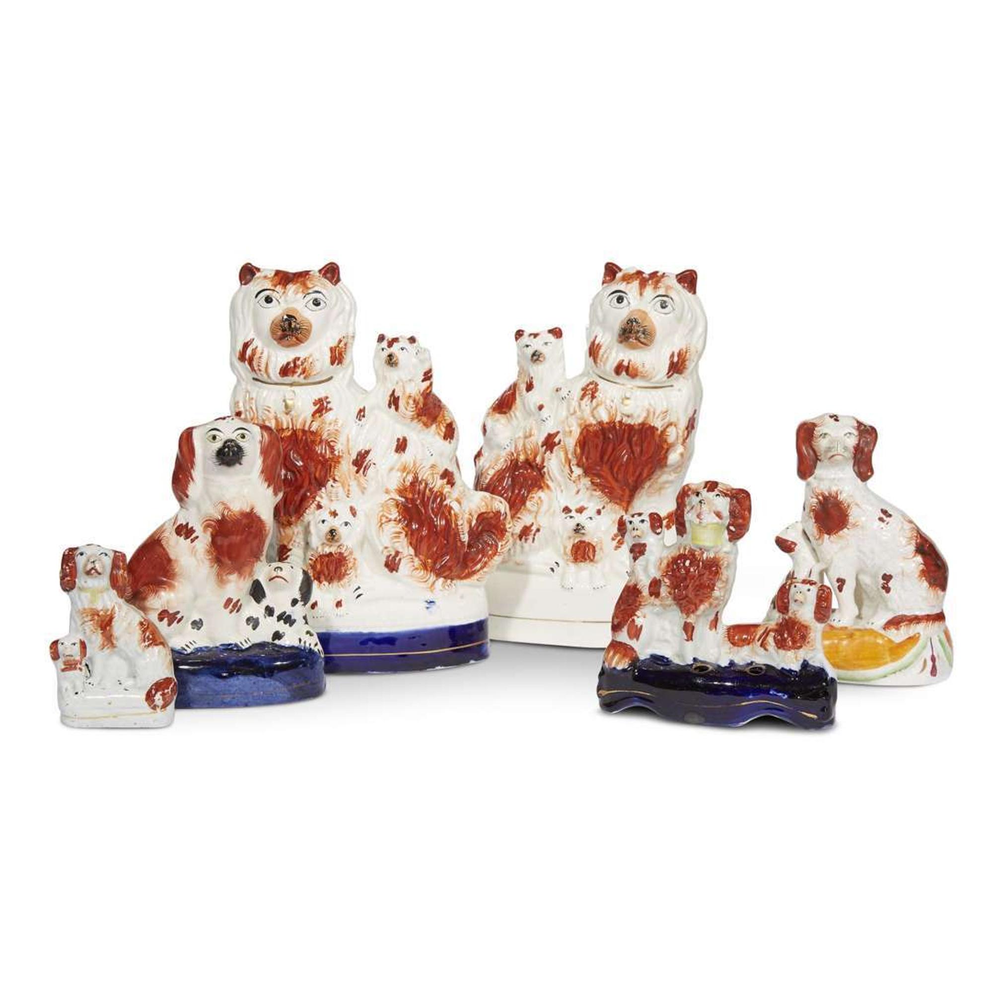 A large collection of seated Staffordshire dog figures 19th/20th centuries