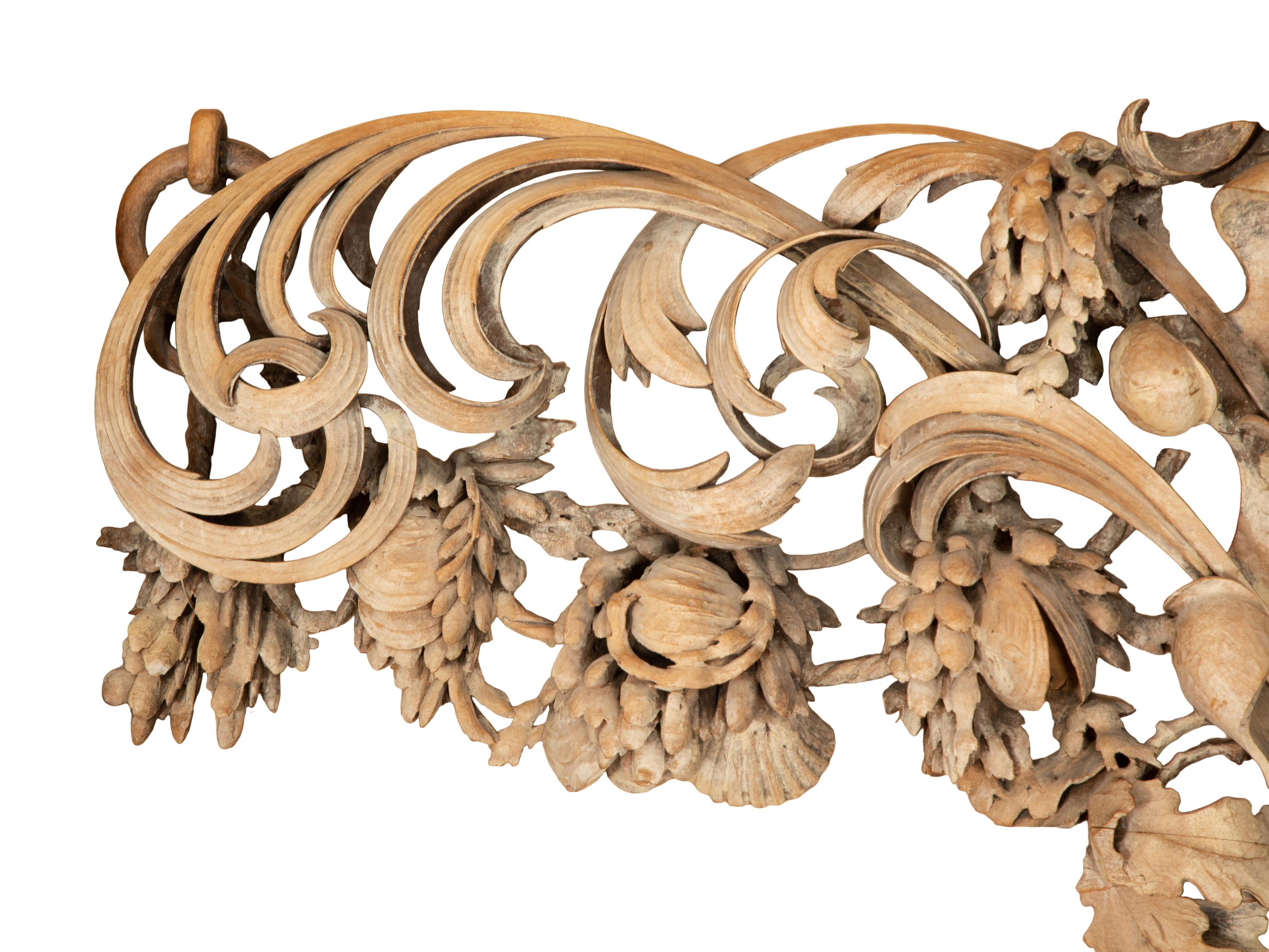 A French Carved Limewood Overdoor Panel Carved with Fruit, Flowers and Seashells