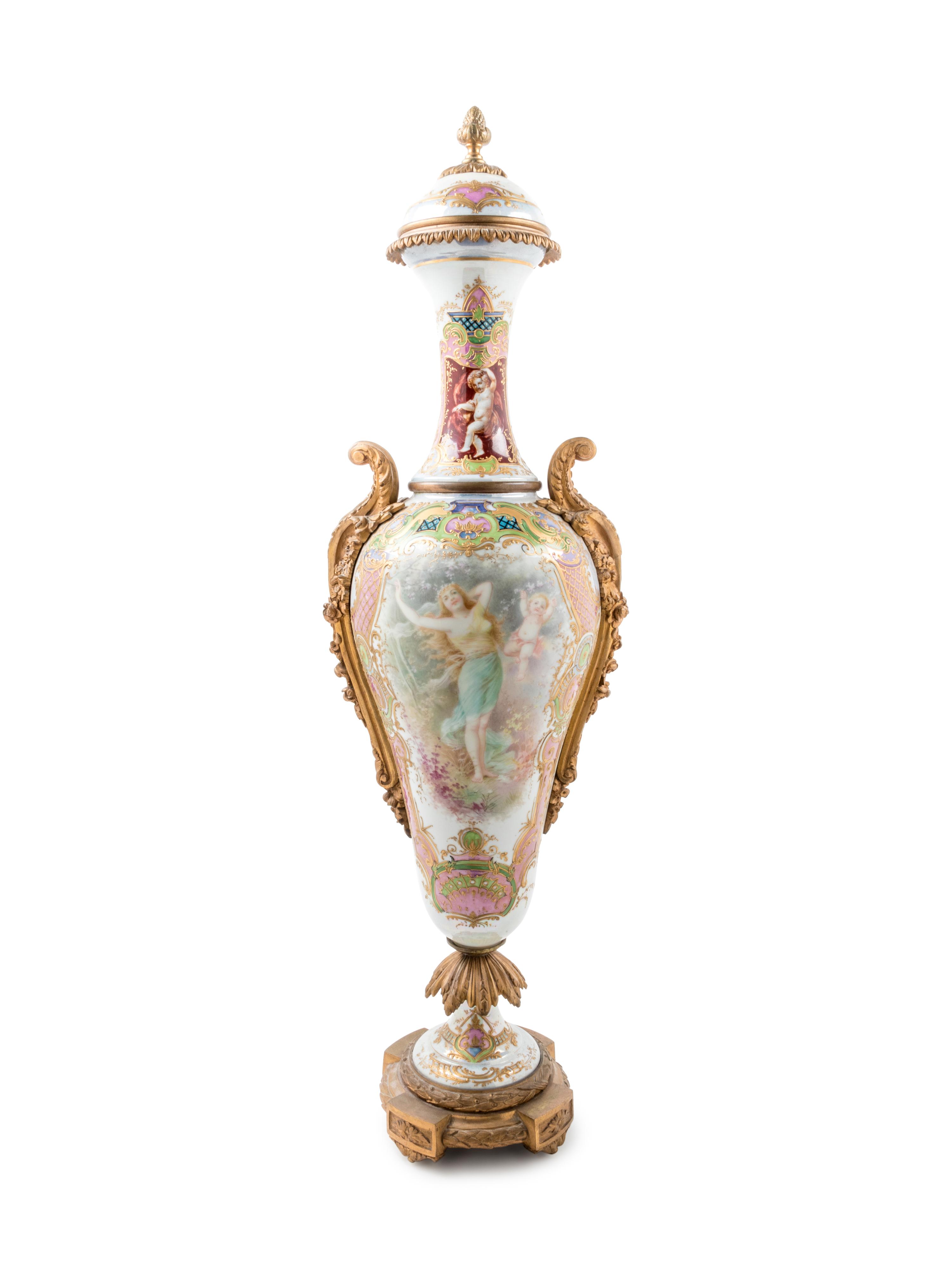 A Large Sèvres Style Gilt Bronze Mounted Painted and Parcel Gilt Porcelain Covered Urn