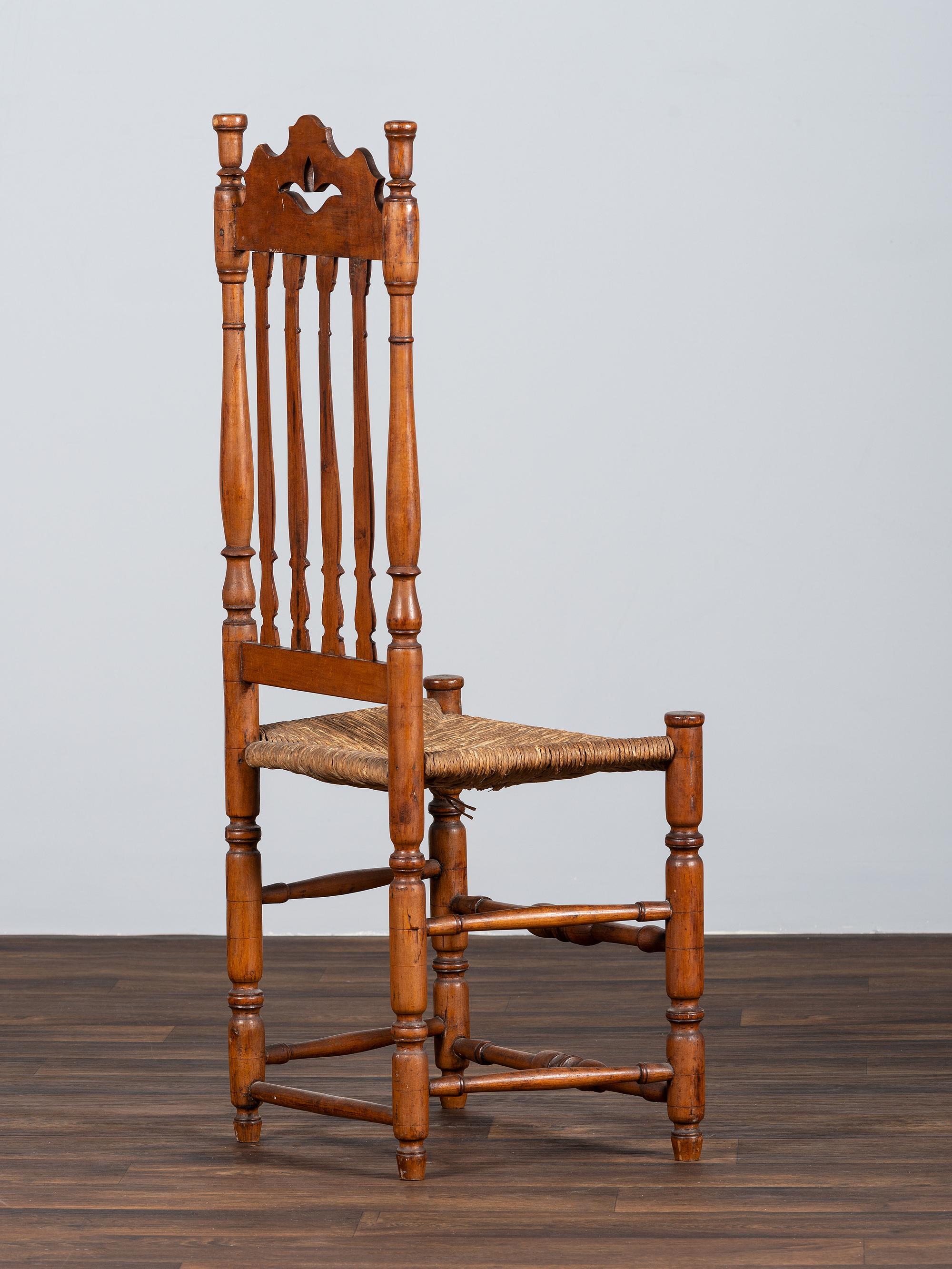 A William and Mary Style Turned and Pierced Carved Banister-Back Rush Seat Side Chair