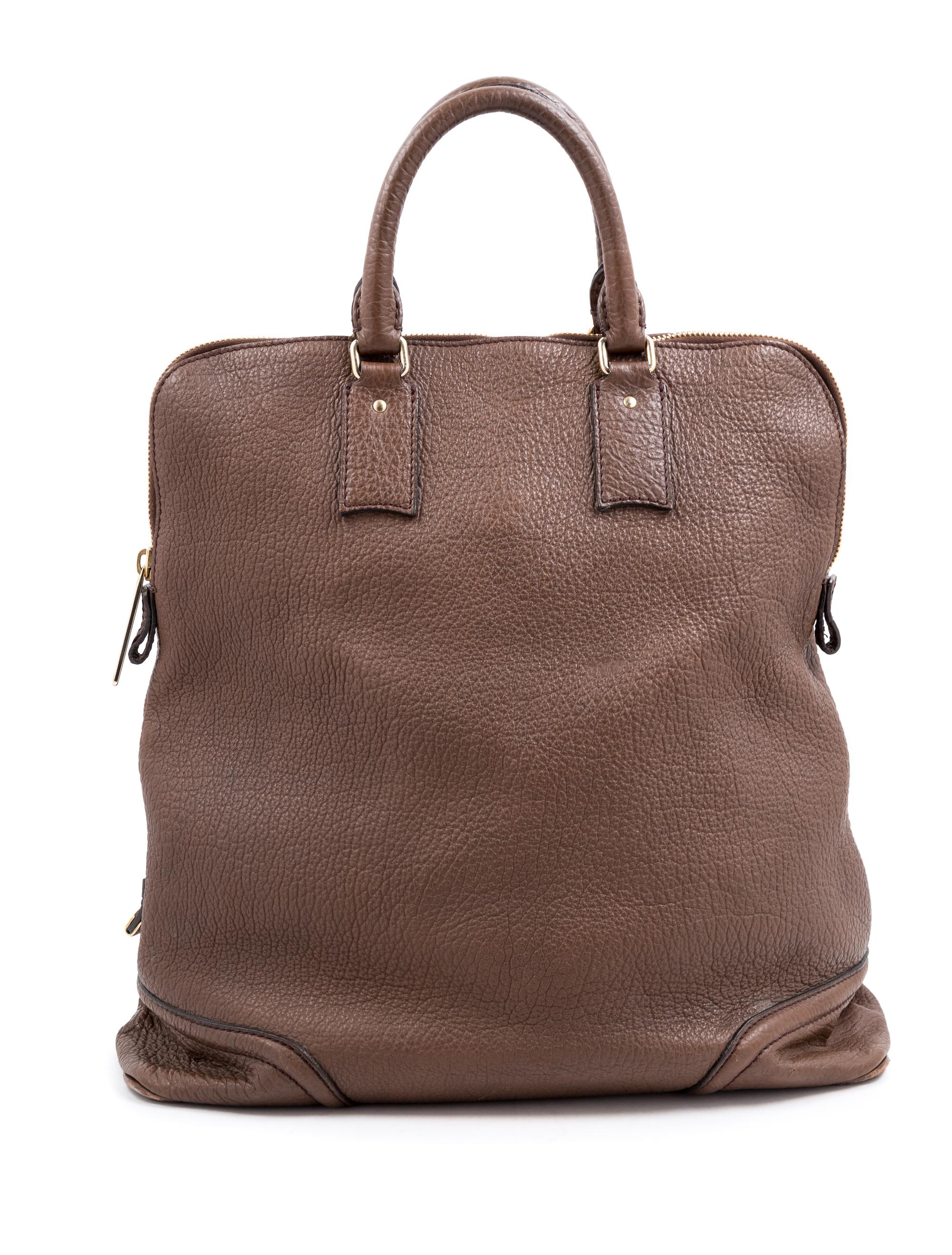 A Burberry Dark Brown Textured Leather Travel Bag, 17" H x 16" W x 6" D; Handle drop: 5".