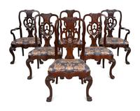 A Set of Twelve Continental Walnut Dining Chairs