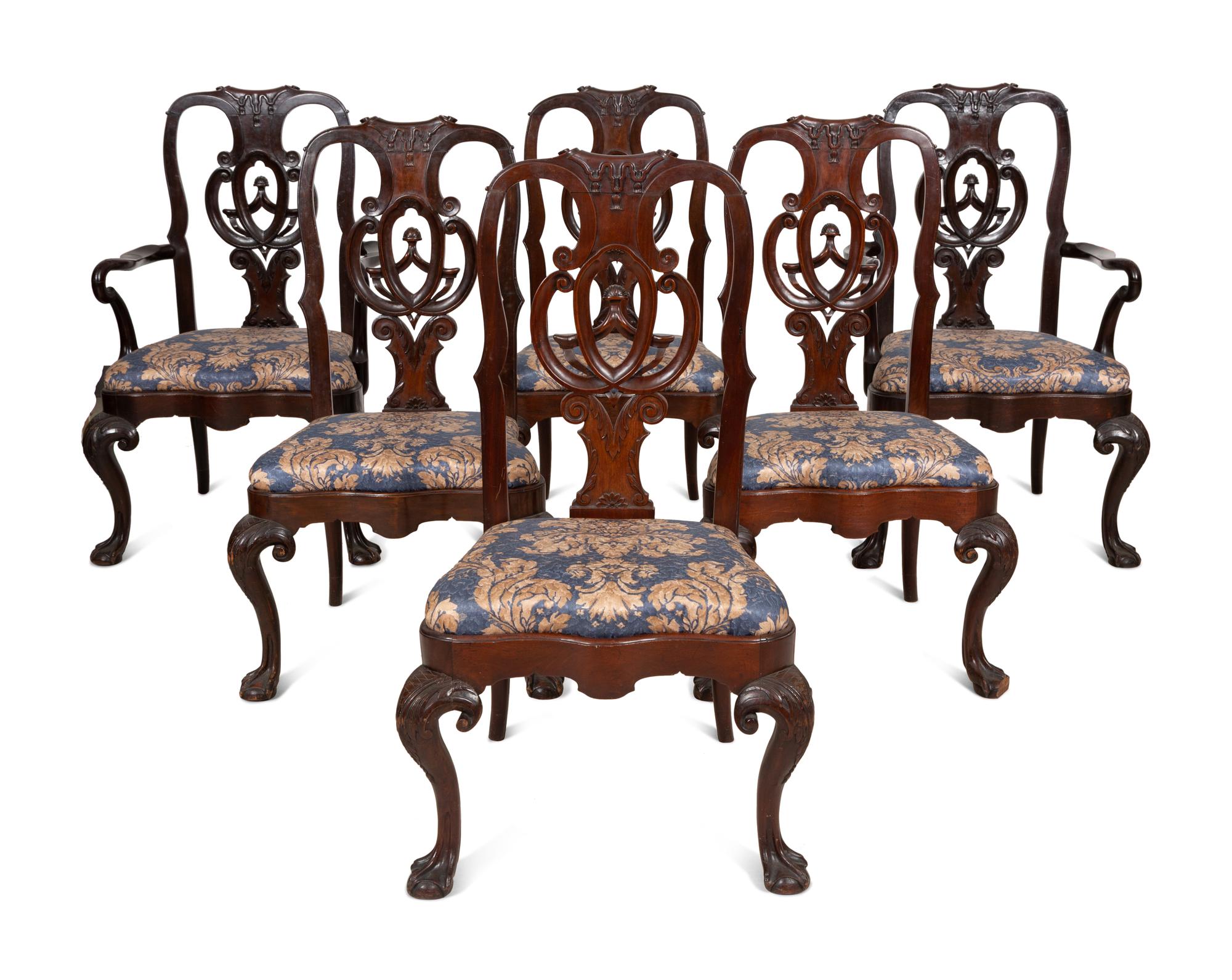 A Set of Twelve Continental Walnut Dining Chairs