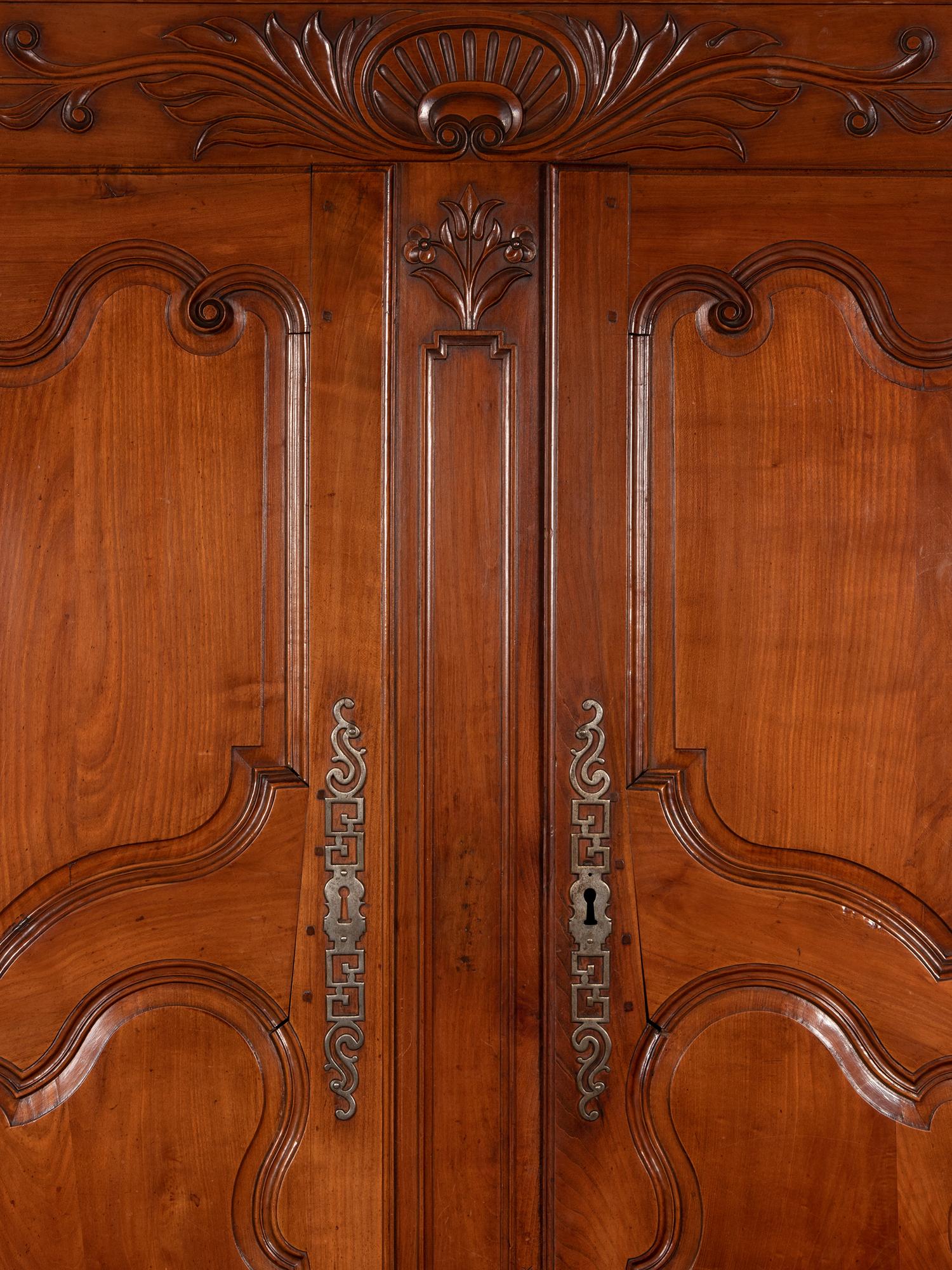 A Louis XV Provincial Cherry Stepback Cupboard