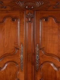 A Louis XV Provincial Cherry Stepback Cupboard