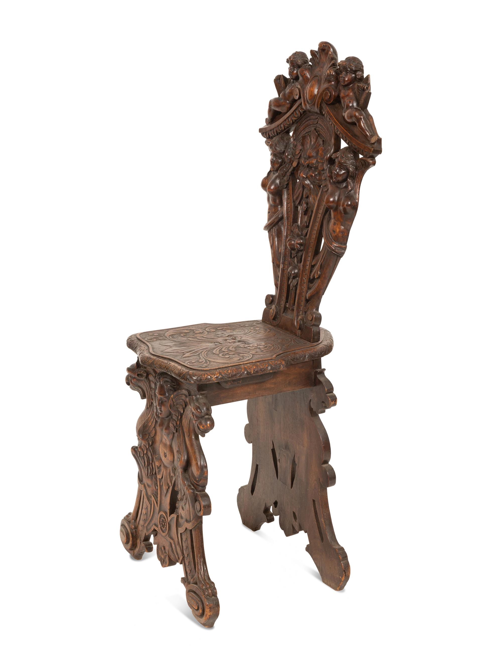 An Italian Renaissance Revival Carved Walnut Sgabello Hall Chair