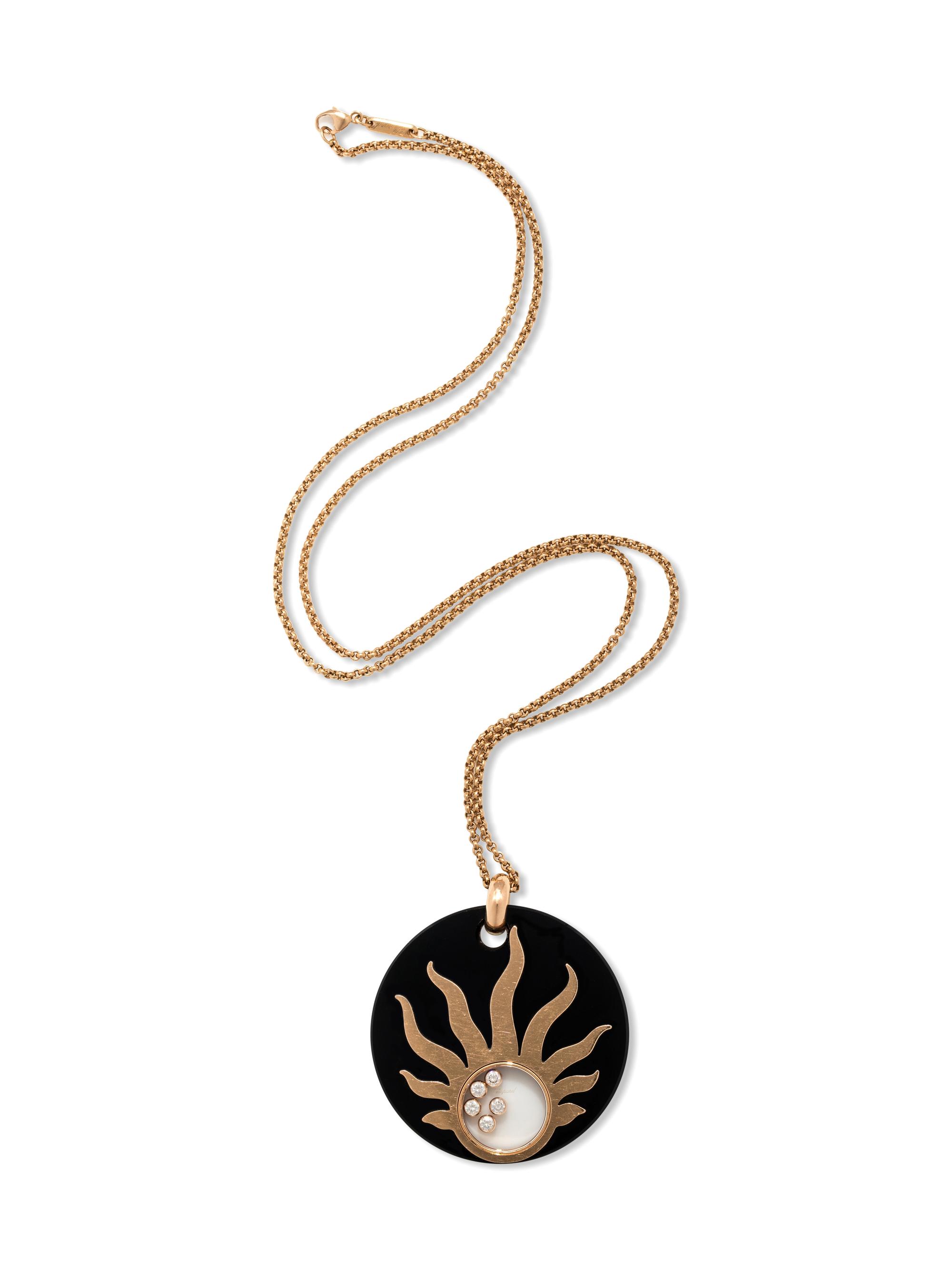 CHOPARD, ONYX AND DIAMOND 'HAPPY SUN' PENDANT/NECKLACE