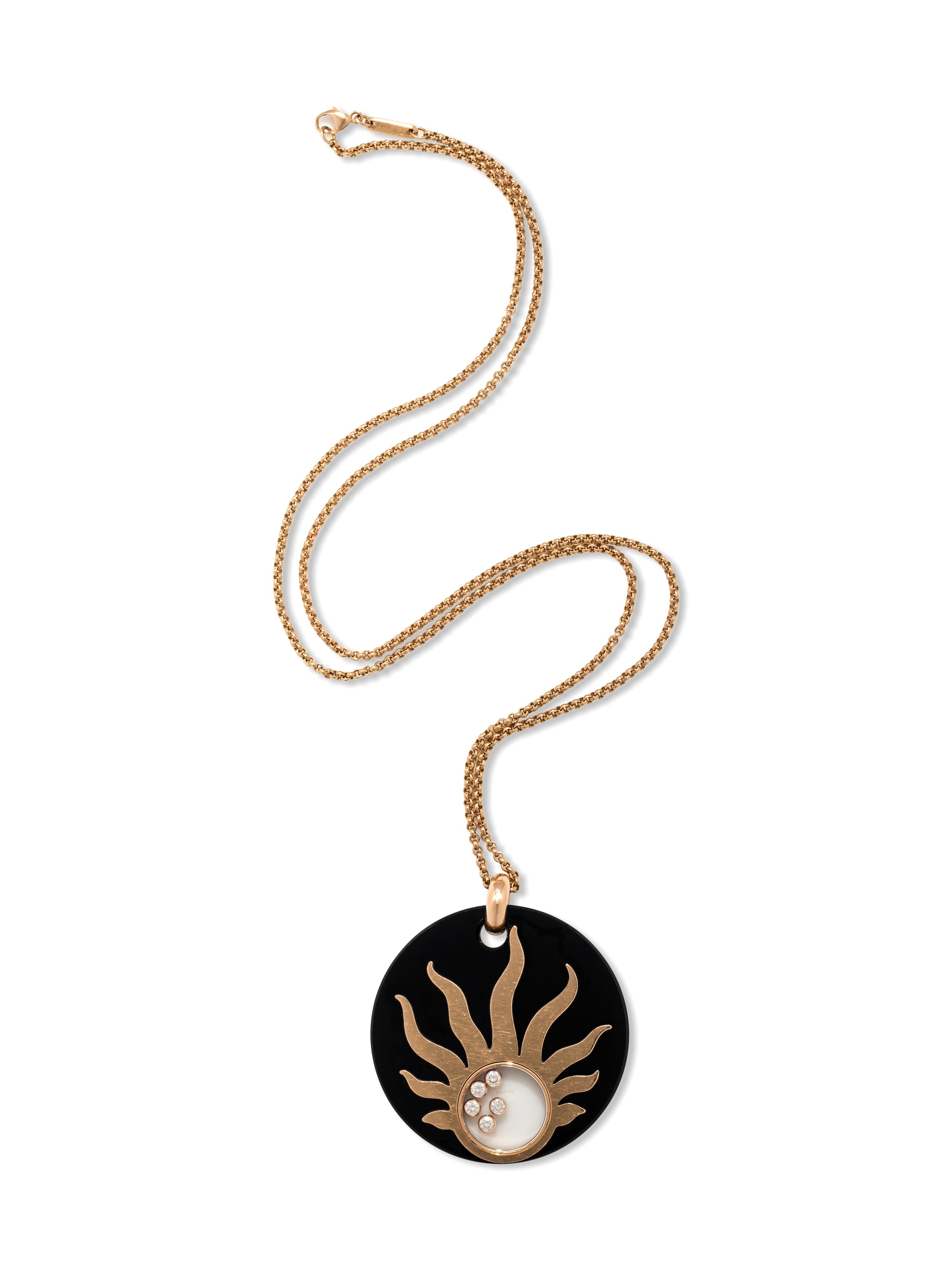 CHOPARD, ONYX AND DIAMOND 'HAPPY SUN' PENDANT/NECKLACE