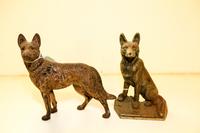 Two Cast Iron Doorstops Height of tallest 9 1/2 inches.