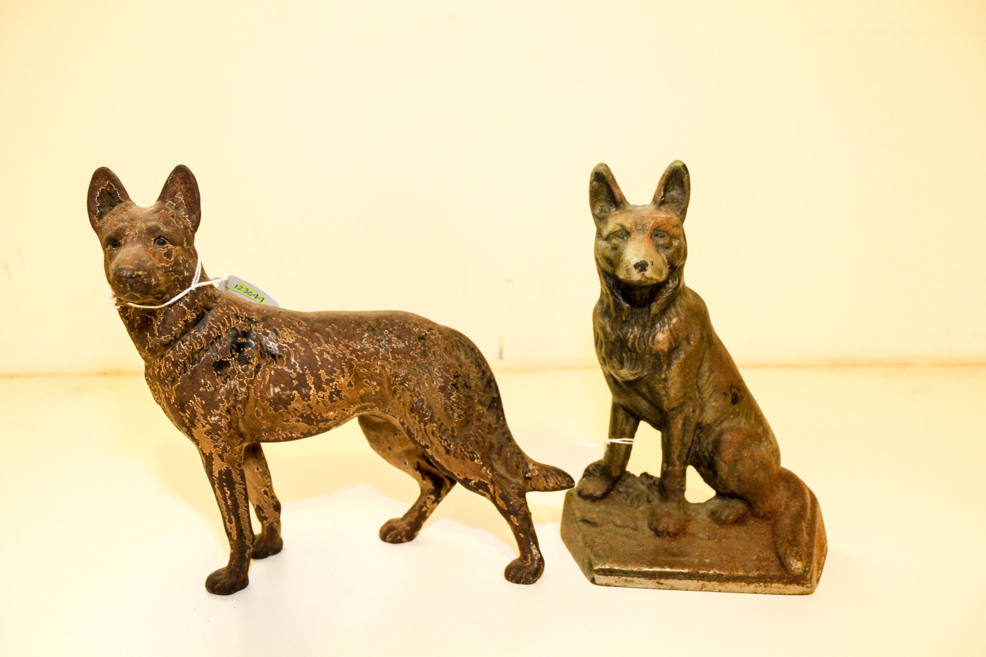 Two Cast Iron Doorstops Height of tallest 9 1/2 inches.