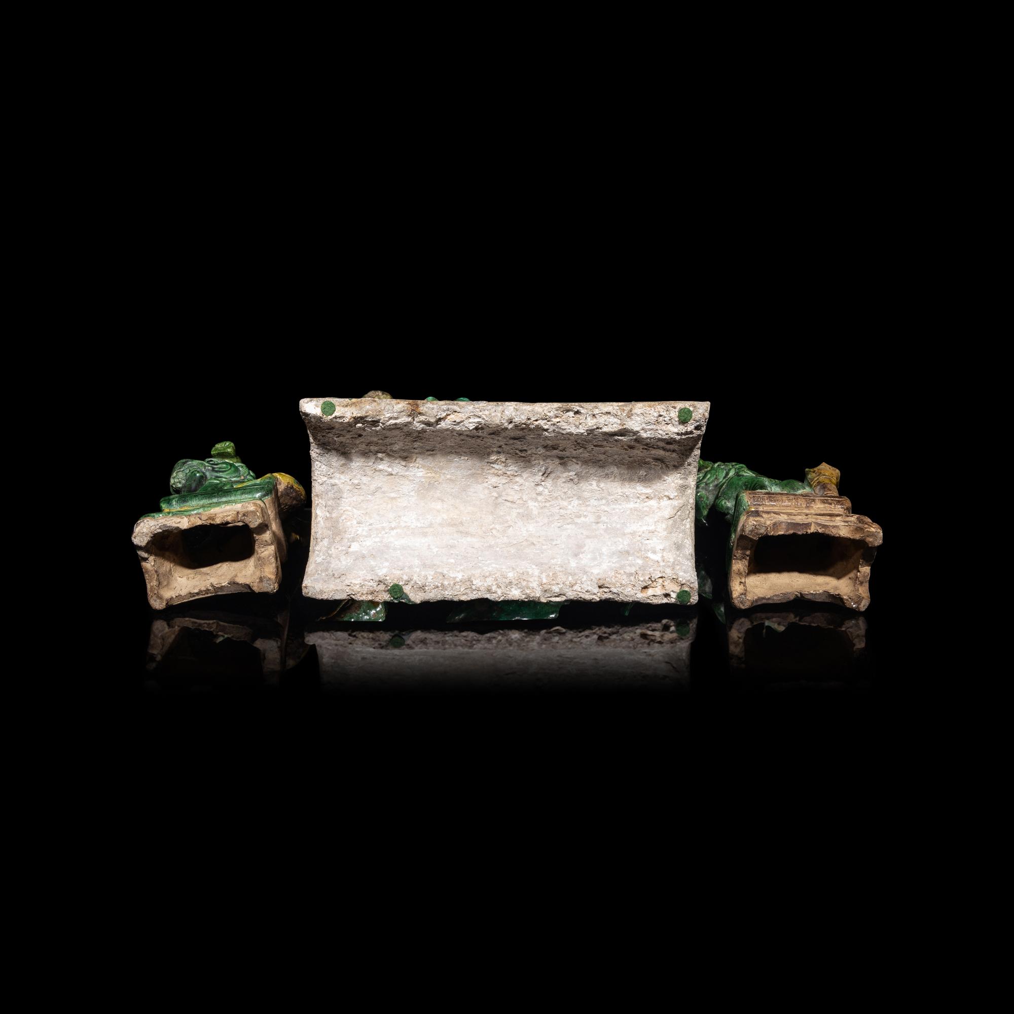 A Chinese Sancai Glazed ' Lion' Roof Tile and a Pair of Figures of Lions, Ming Dynasty 明 素三彩佛獅瓦當及佛獅像一對