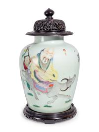 A Chinese Export Famille Rose Porcelain Jar and Carved Wood Cover