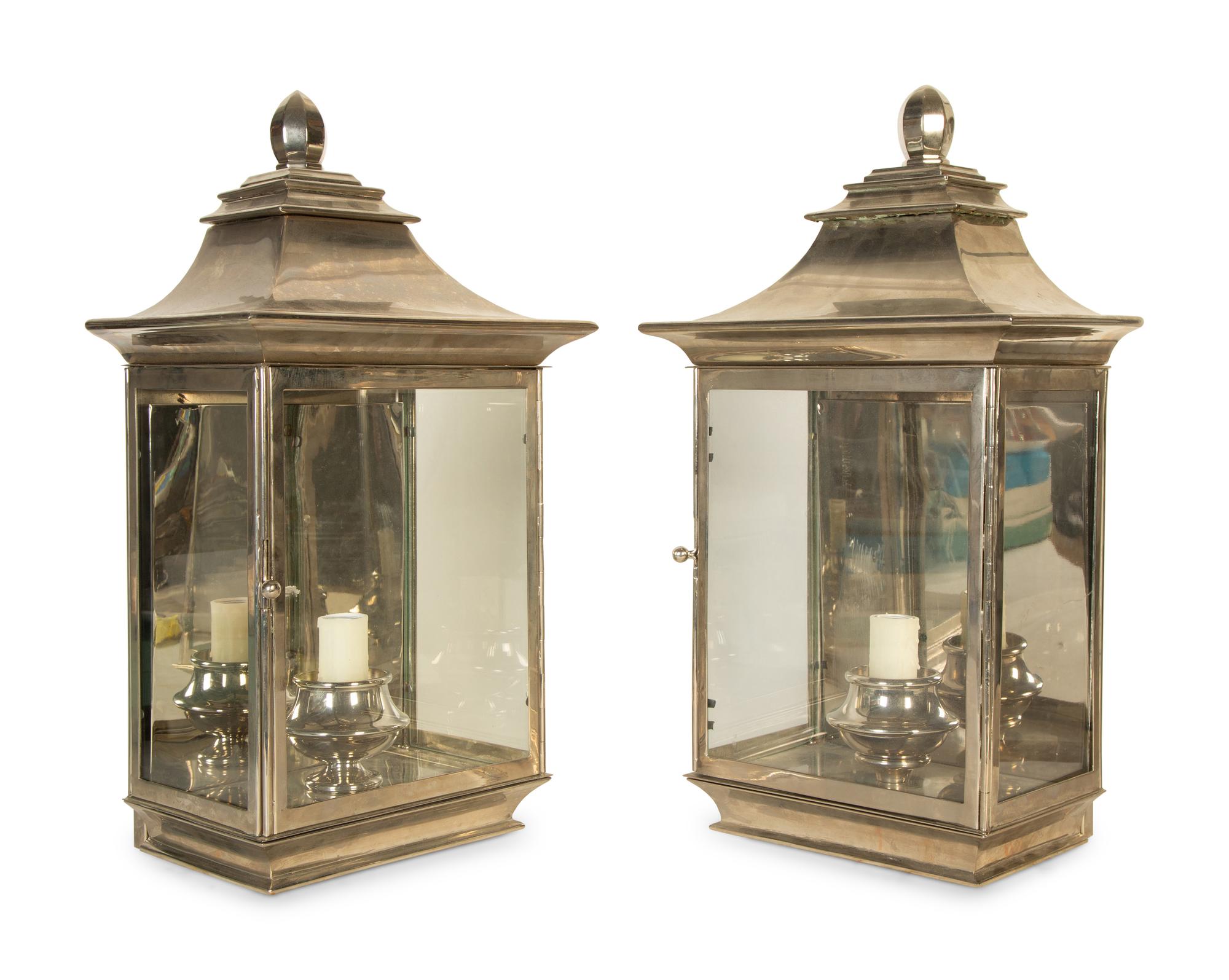 A Pair of Polished Silvered Metal and Glass Wall Lanterns