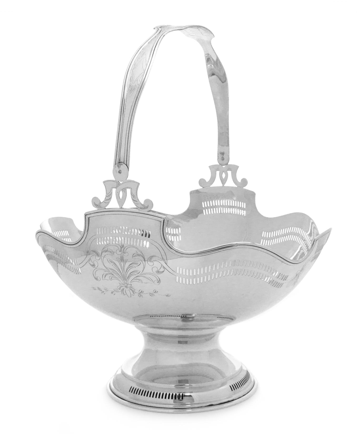 An American Silver Fruit Basket, Maker's Mark Obscured, of ovoid form, both the handle and body worked to show floral spray and foliate