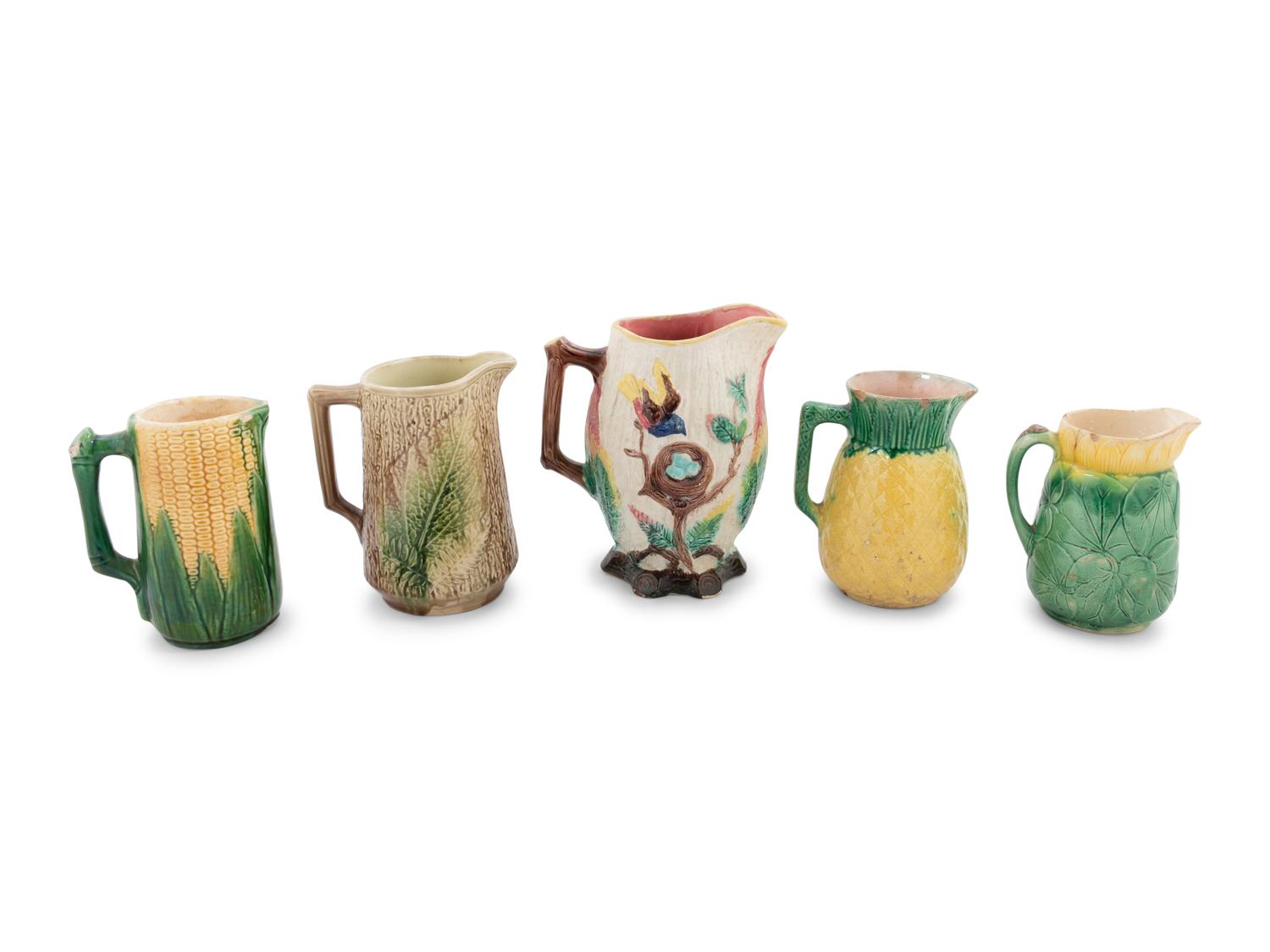 A Group of Nine Majolica Pitchers