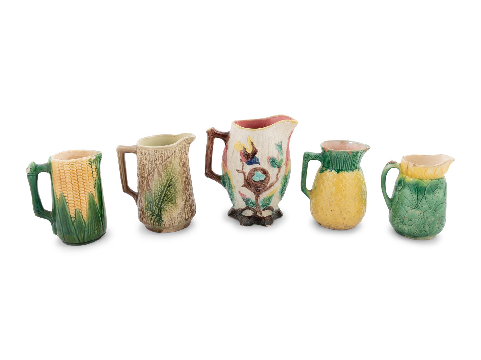 A Group of Nine Majolica Pitchers