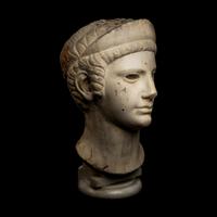 A Roman Marble Archaistic Head of a Goddess