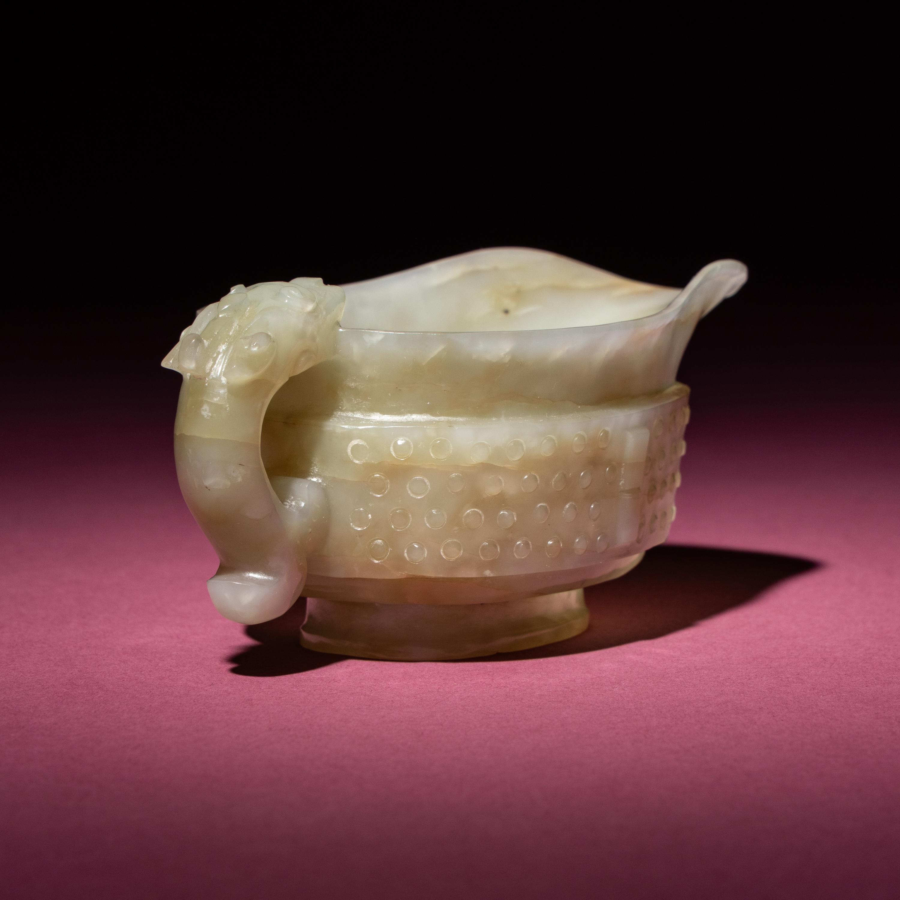 A Chinese Pale Celadon Jade Archaistic Yi Vessel, 17th Century — 清早期 青白玉仿古龍紋匜