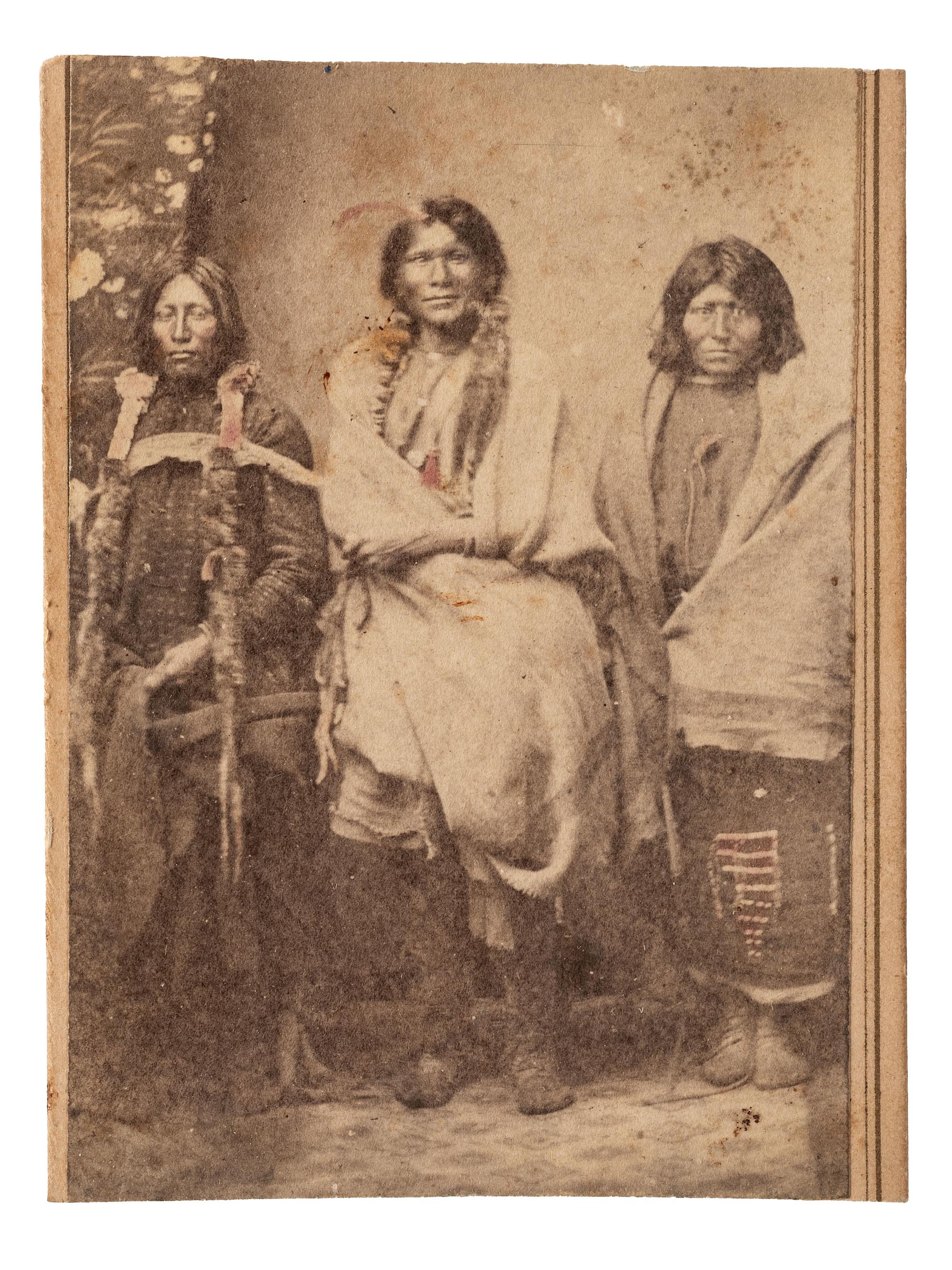 [NATIVE AMERICANS]. MCKENNY, A.S., photographer. CDV of Ute Indians in a studio setting. Blackhawk, Colorado Territory. Ca 1870.