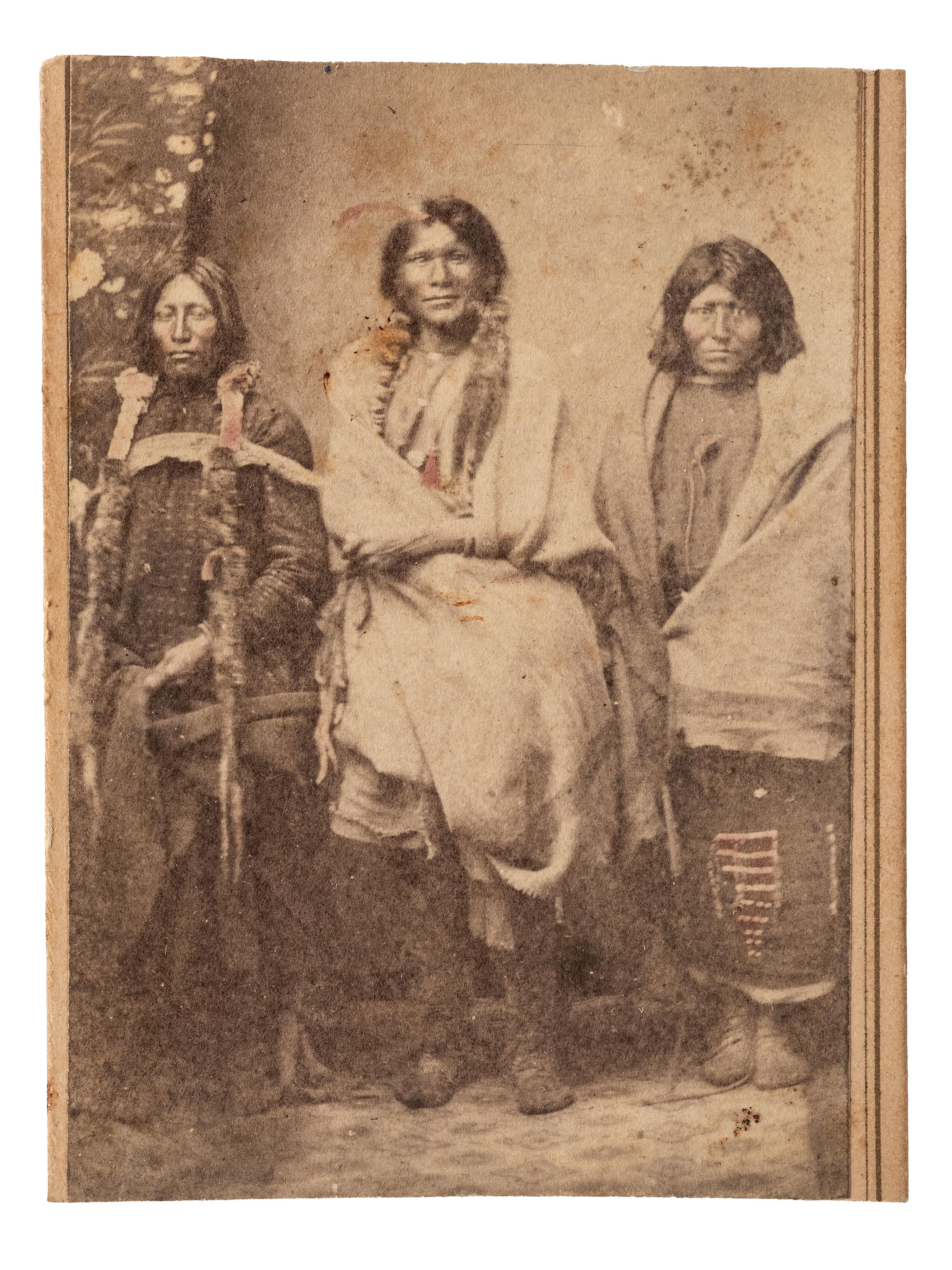 [NATIVE AMERICANS]. MCKENNY, A.S., photographer. CDV of Ute Indians in a studio setting. Blackhawk, Colorado Territory. Ca 1870.
