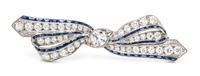 An Art Deco Platinum, Diamond and Synthetic Sapphire Bow Brooch, 5.20 dwts.