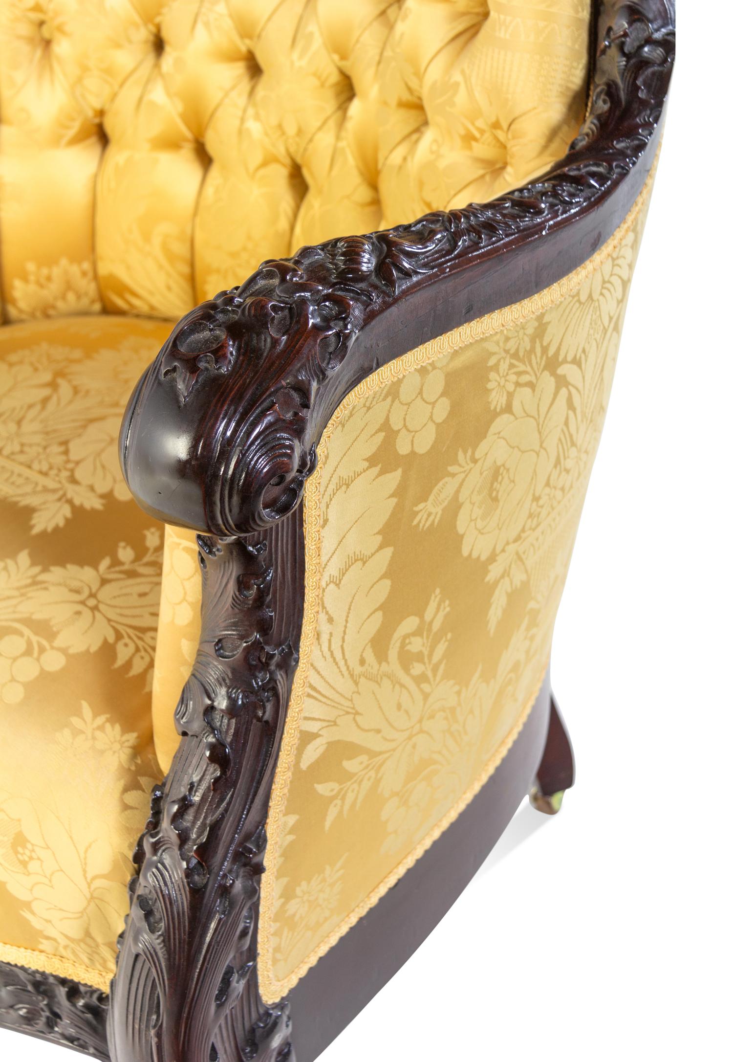 A Karpen Carved Mahogany Three-Piece Parlor Suite