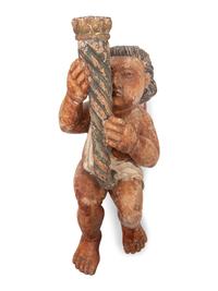 A Spanish Colonial Carved and Polychromed Putto Candlestick