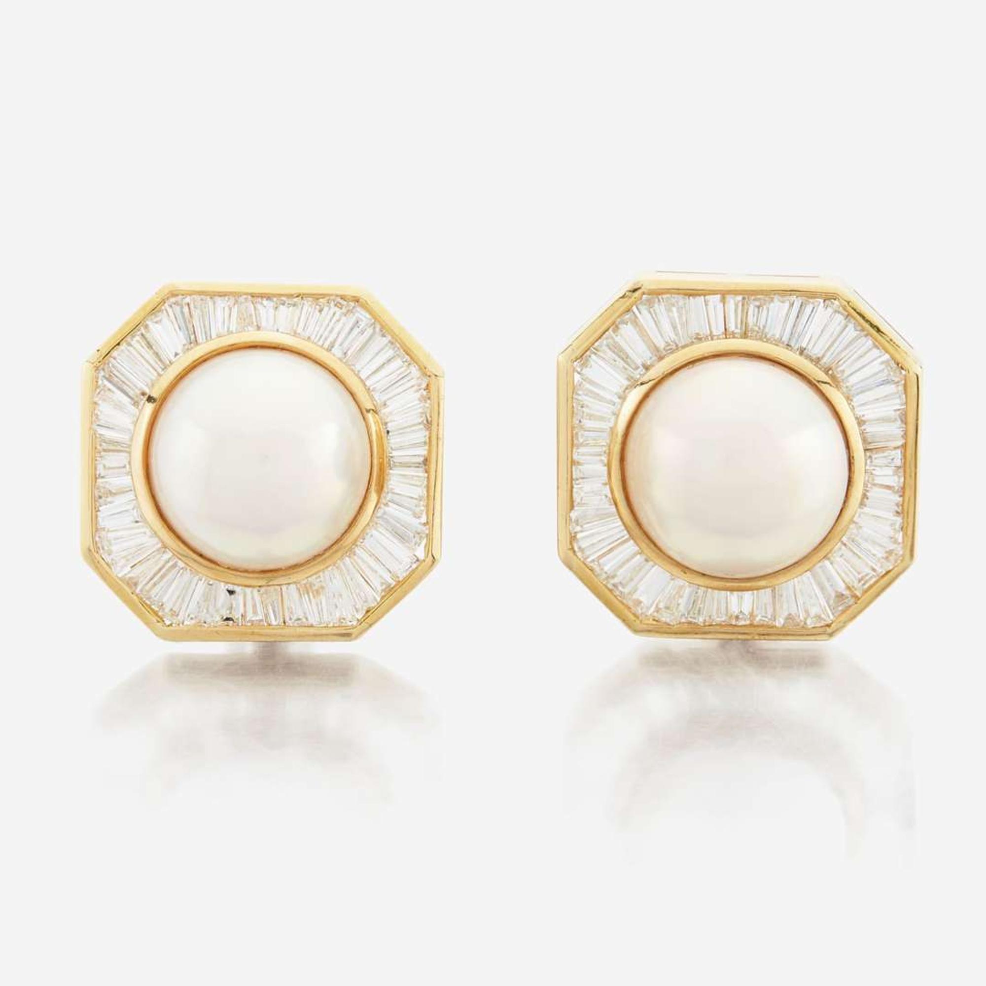 A pair of pearl, diamond and white gold earrings
