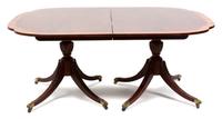 A George III Style Inlaid Mahogany Pedestal Dining Table Height 29 x length closed 69 x width 46 inches. — 20TH CENTURY