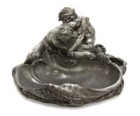 A French Pewter Vide Poche, after Claude Michel (Clodion), Width 16 1/2 inches.