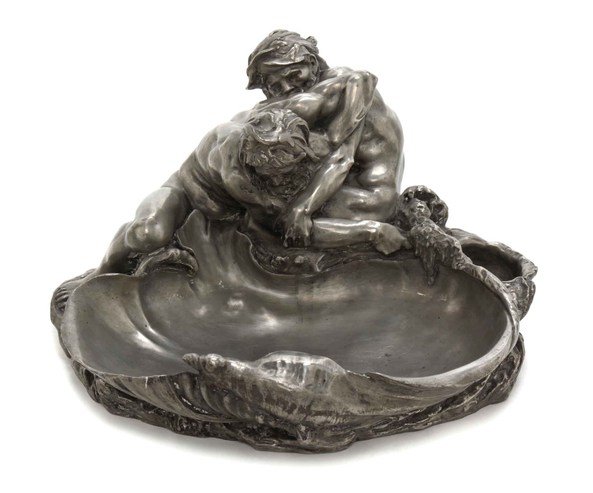 A French Pewter Vide Poche, after Claude Michel (Clodion), Width 16 1/2 inches.