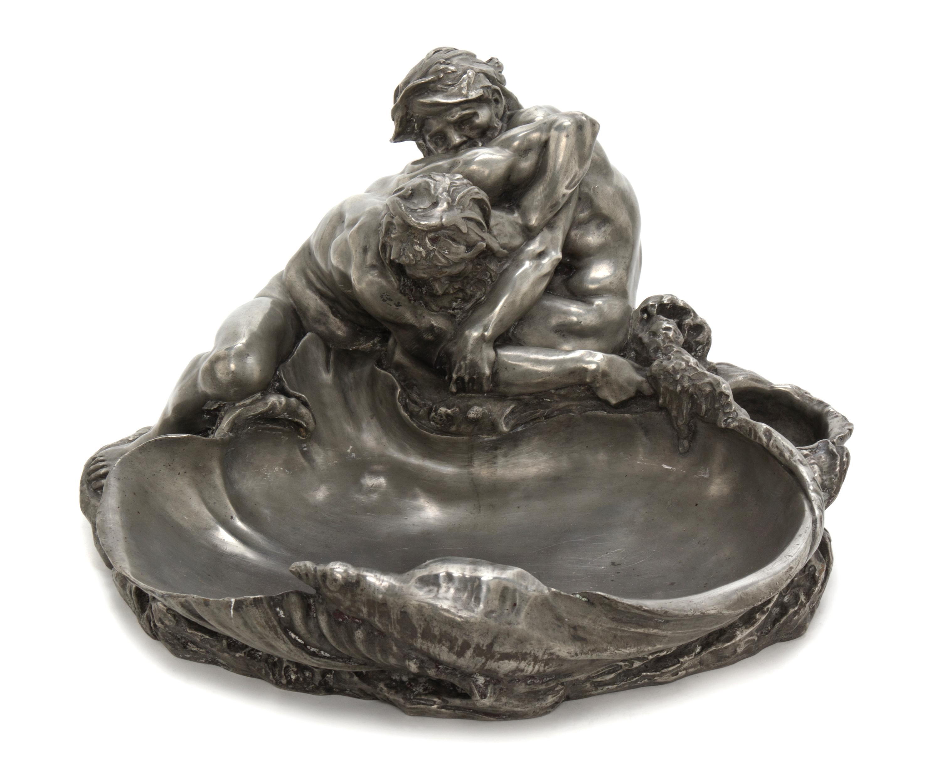 A French Pewter Vide Poche, after Claude Michel (Clodion), Width 16 1/2 inches.