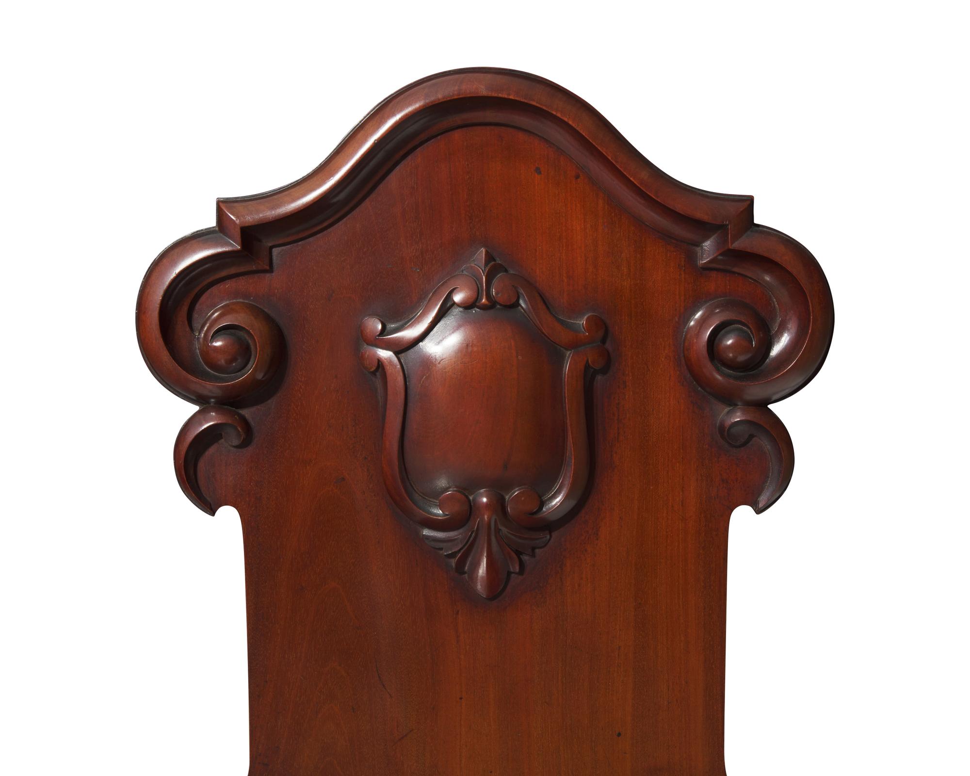 A pair of Victorian mahogany hall chairs, circa 1850