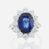 A sapphire, diamond and gold ring