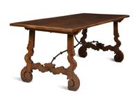 A Spanish Walnut and Wrought Iron Trestle Table