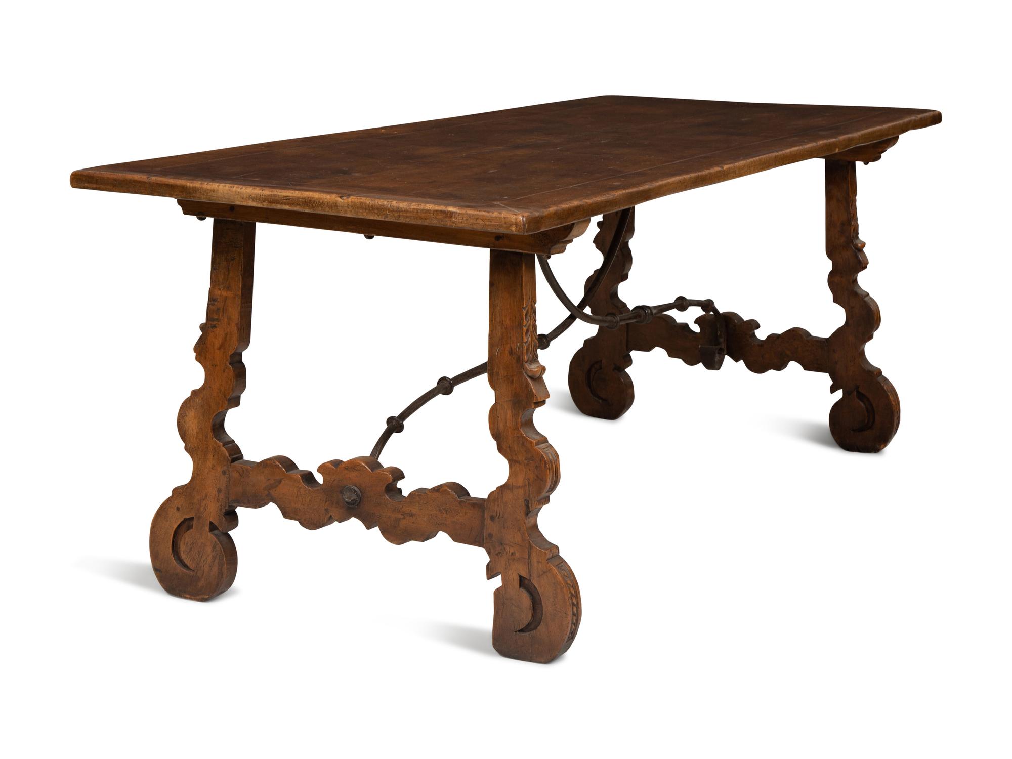 A Spanish Walnut and Wrought Iron Trestle Table