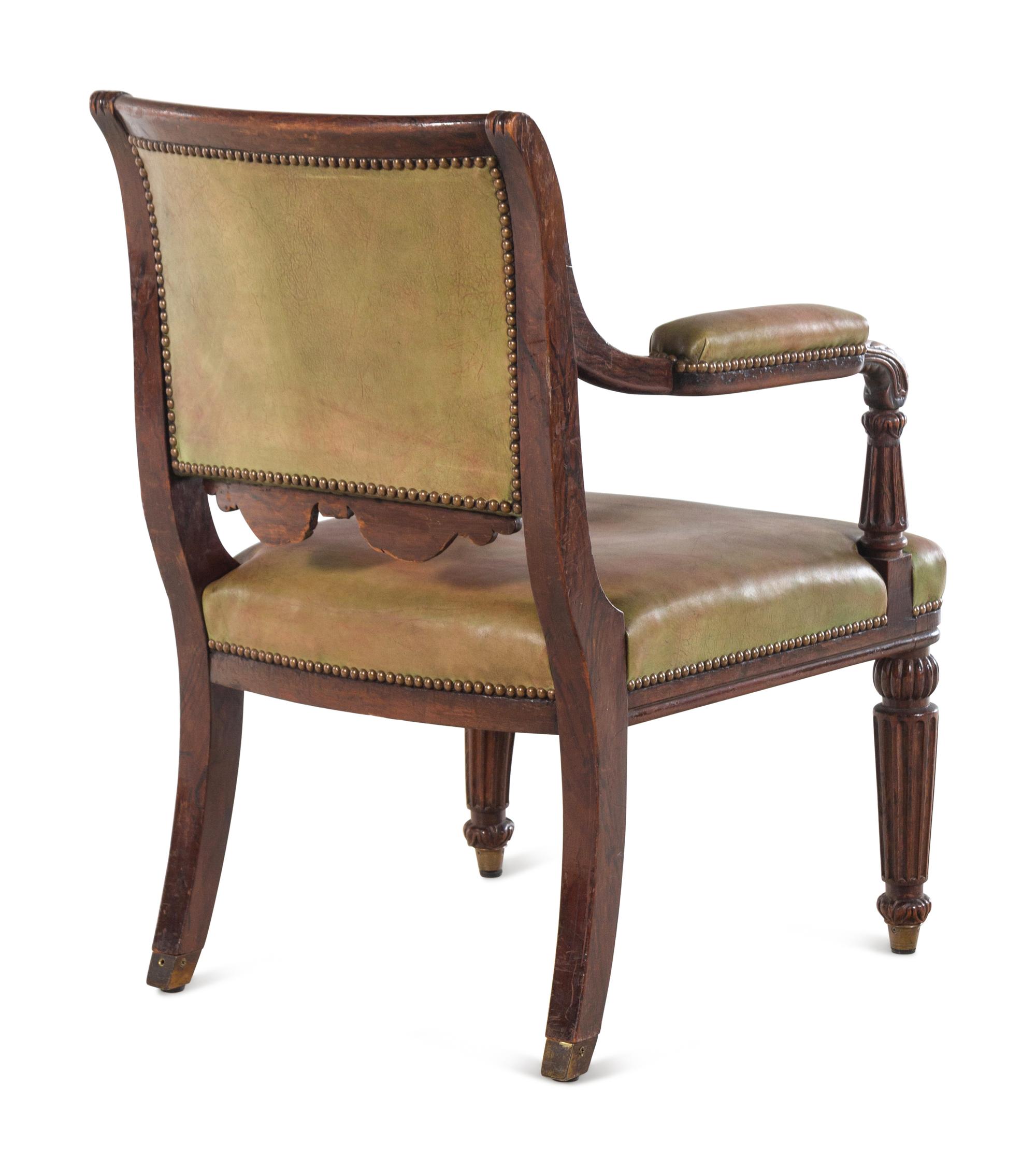 A Regency Simulated Rosewood Leather-Upholstered Library Chair in the Manner of Henry Holland