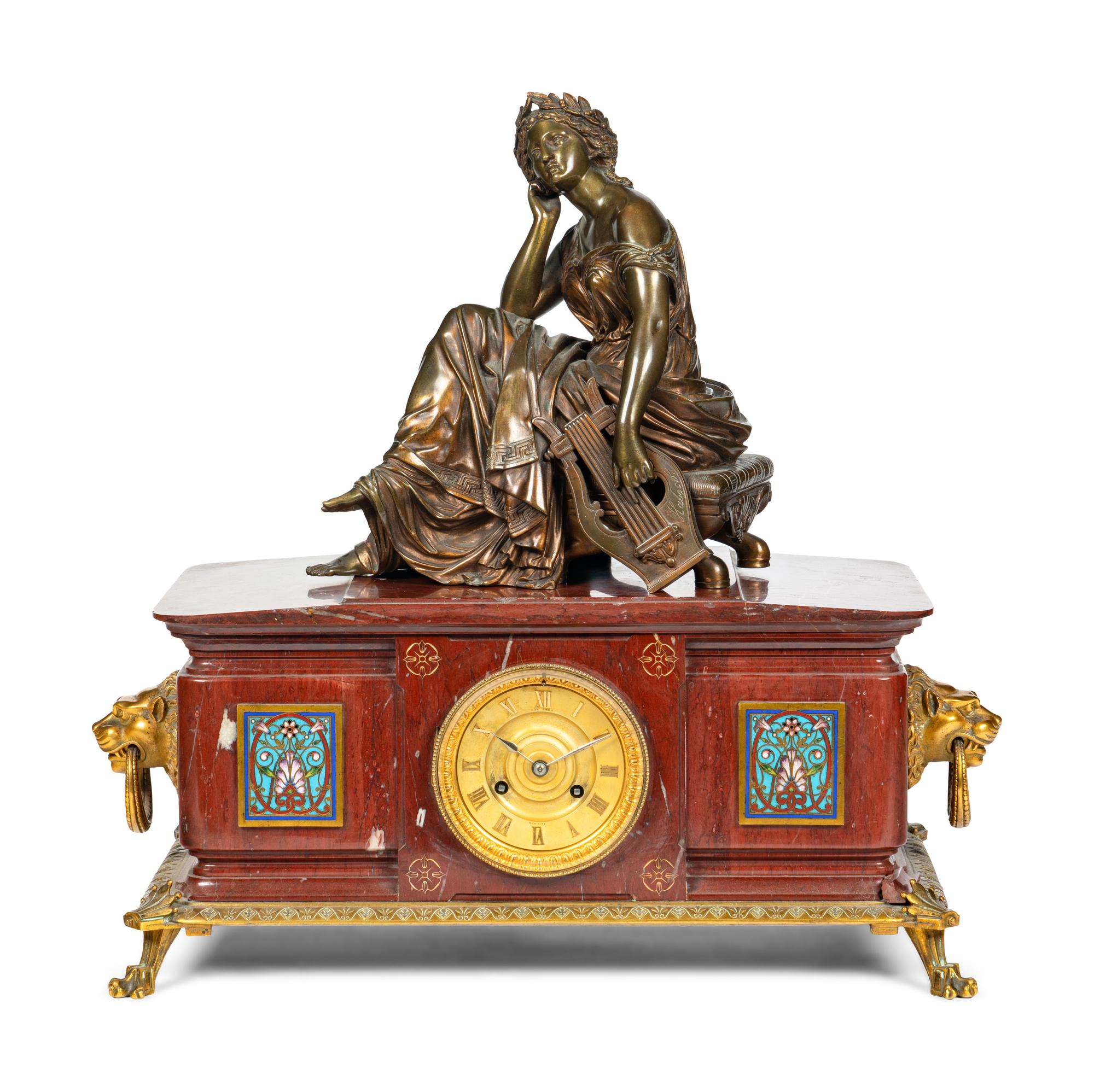 A French Bronze, Marble and Champlevé Clock Garniture