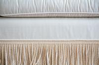 A Three Cushion Linen Silk Upholstered Sofa — 20TH CENTURY