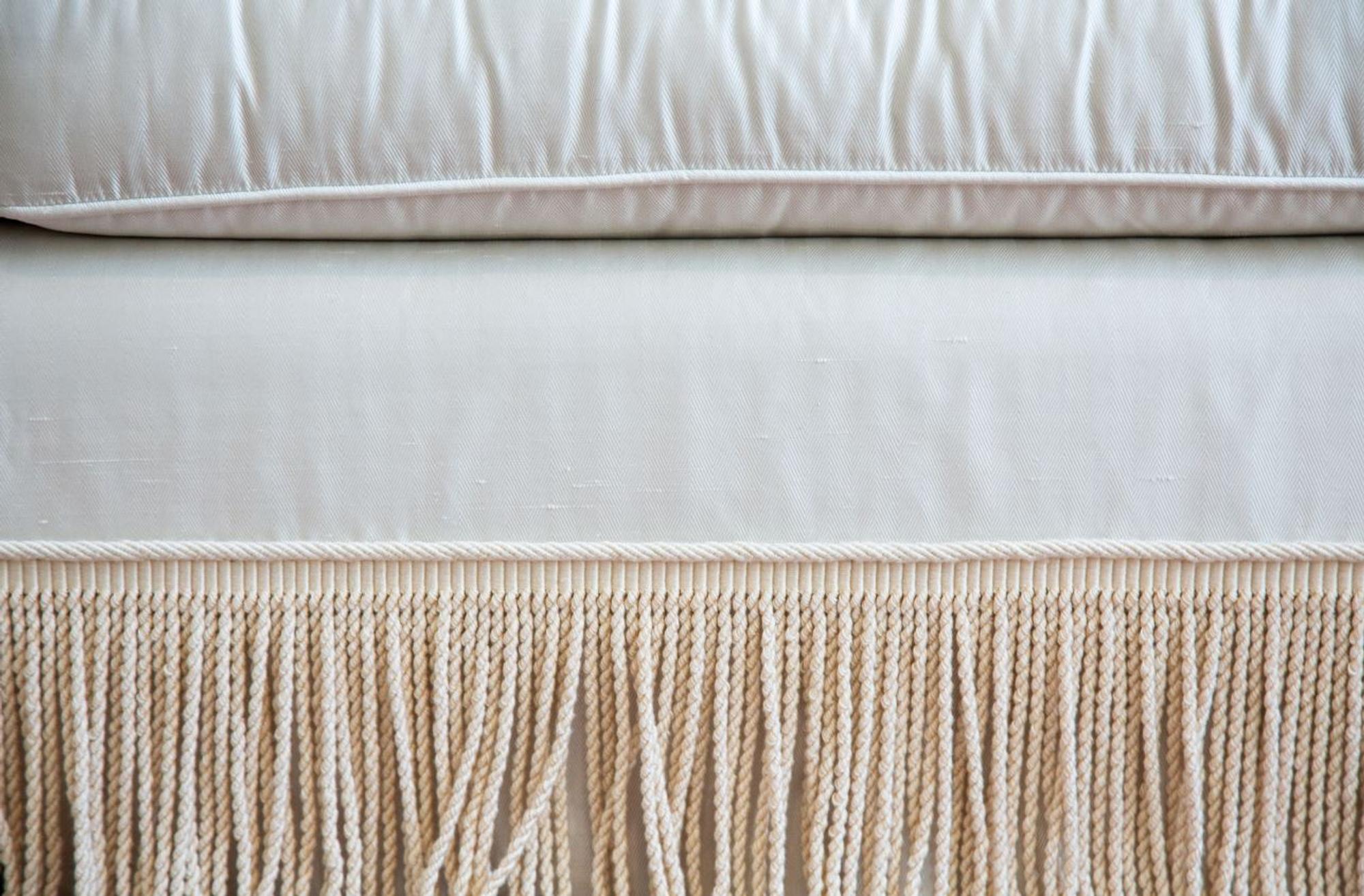 A Three Cushion Linen Silk Upholstered Sofa — 20TH CENTURY