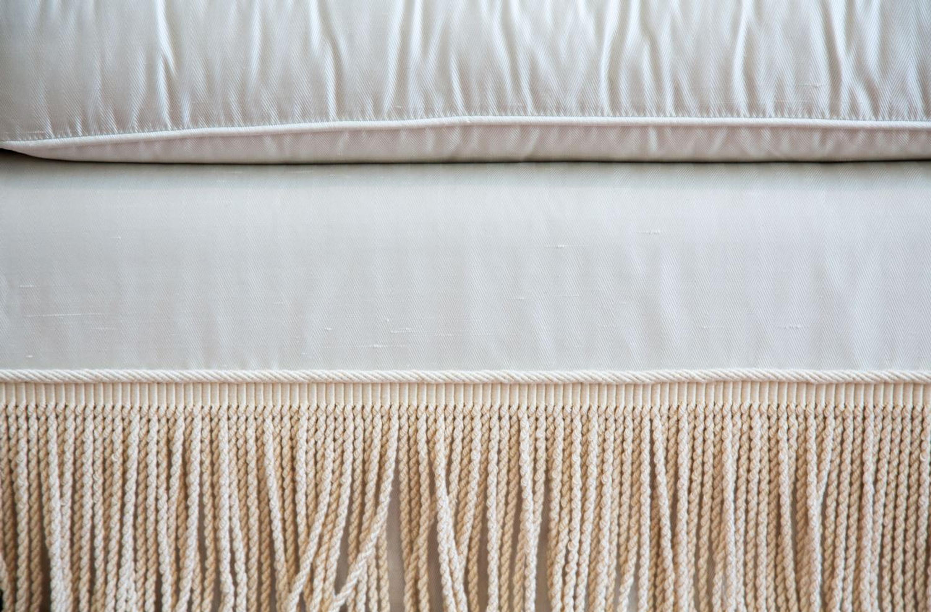 A Three Cushion Linen Silk Upholstered Sofa — 20TH CENTURY