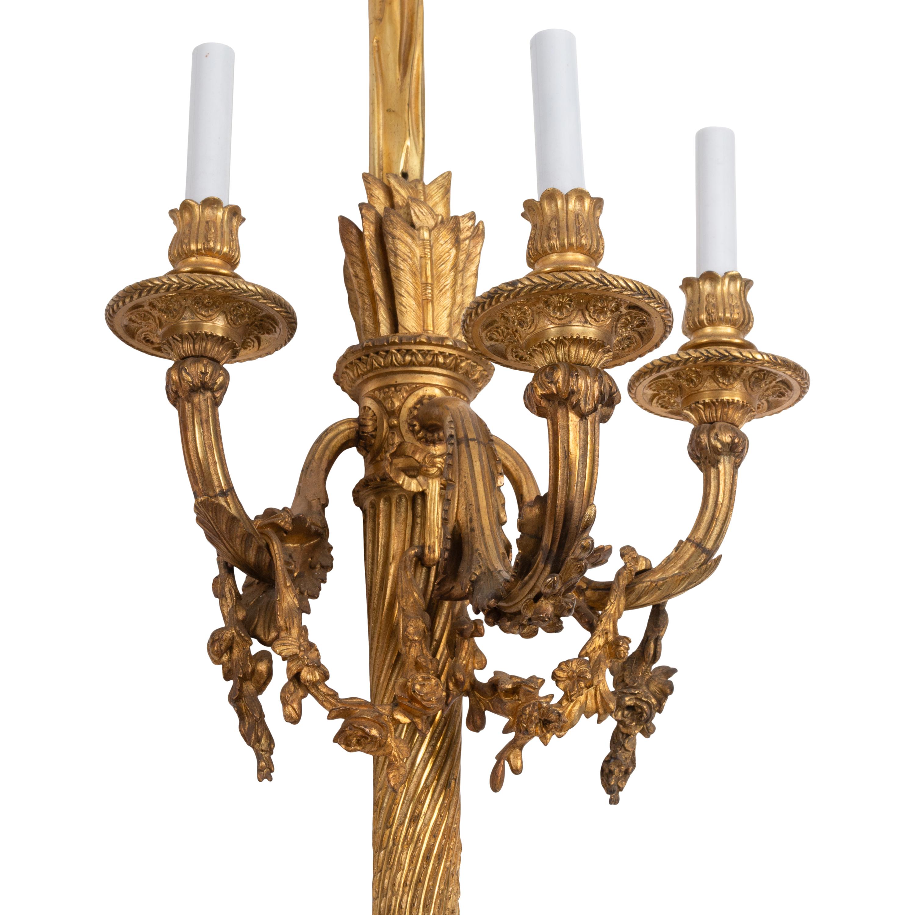 A Set of Four Large French Gilt Bronze Three-Light Sconces