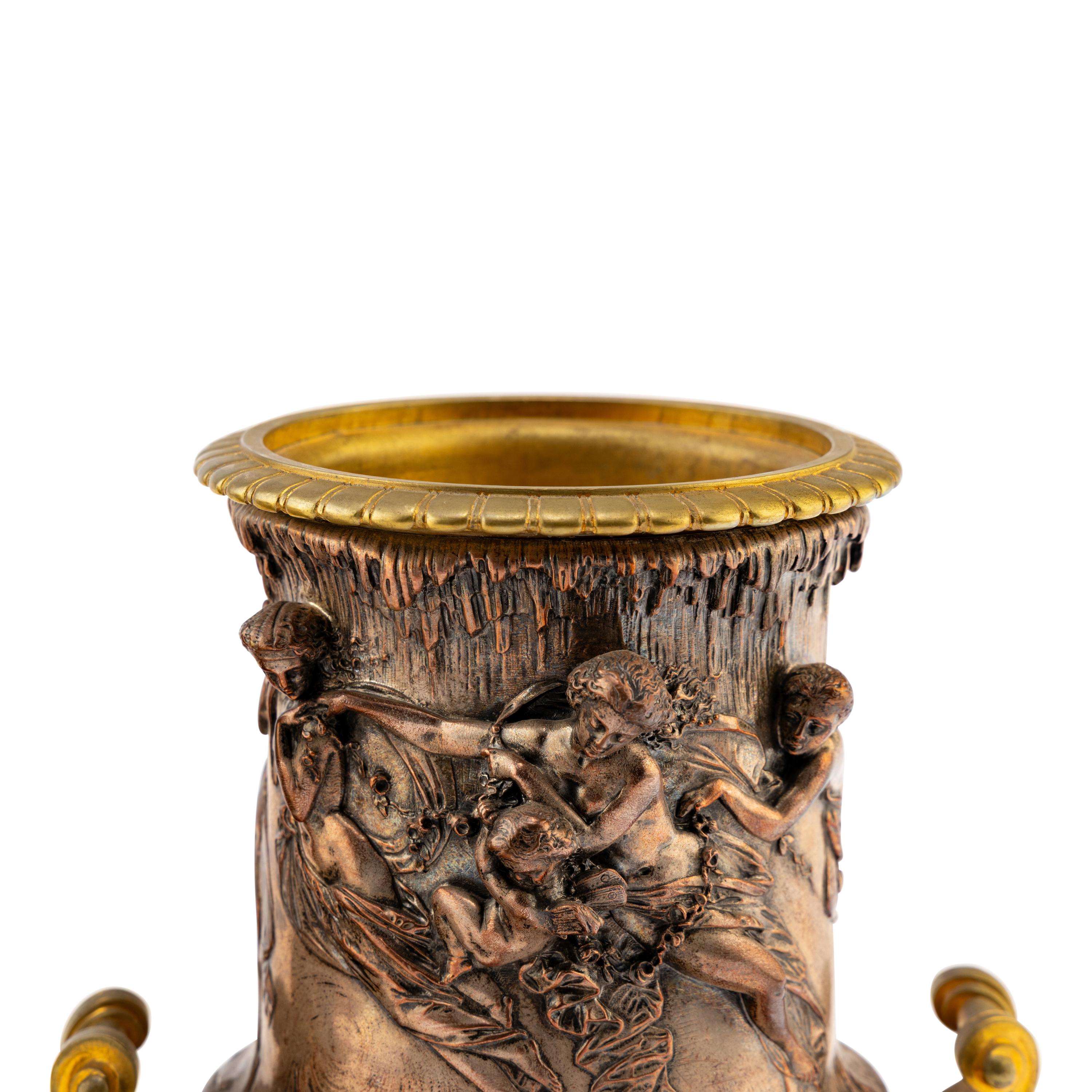 A Pair of French Gilt and Silvered Bronze Urns