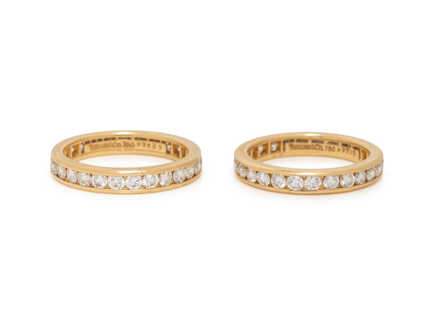 TIFFANY & CO., PAIR OF YELLOW GOLD AND DIAMOND ETERNITY BAND RINGS
