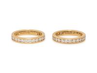 TIFFANY & CO., PAIR OF YELLOW GOLD AND DIAMOND ETERNITY BAND RINGS
