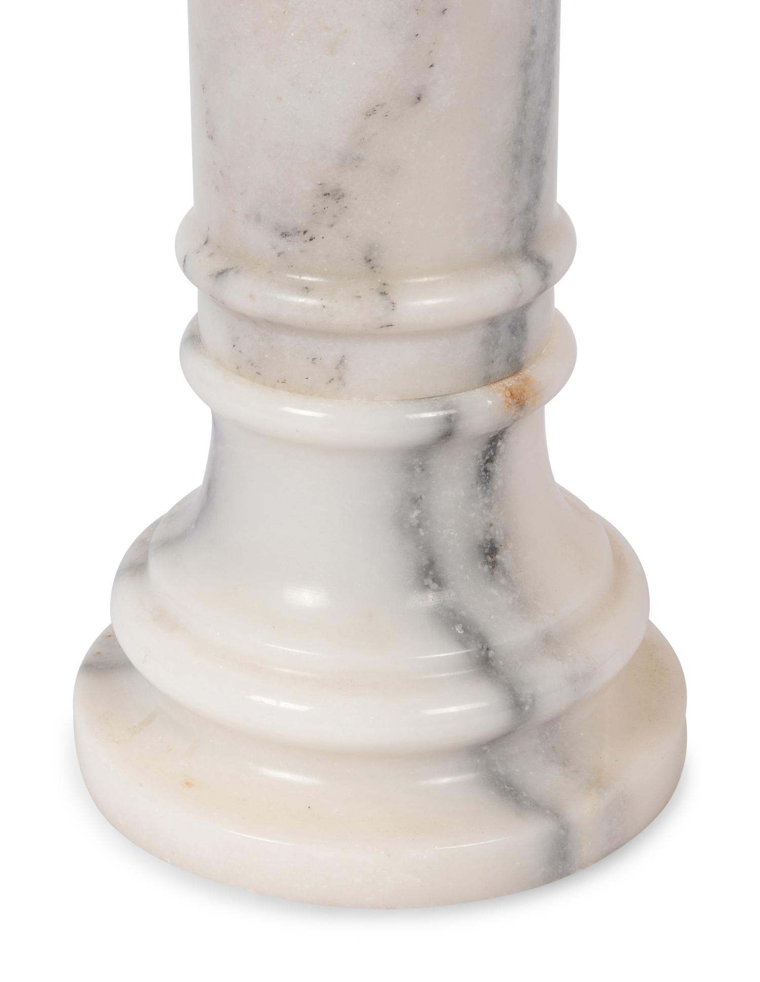 A Pair of Continental Carved Marble Pedestals
