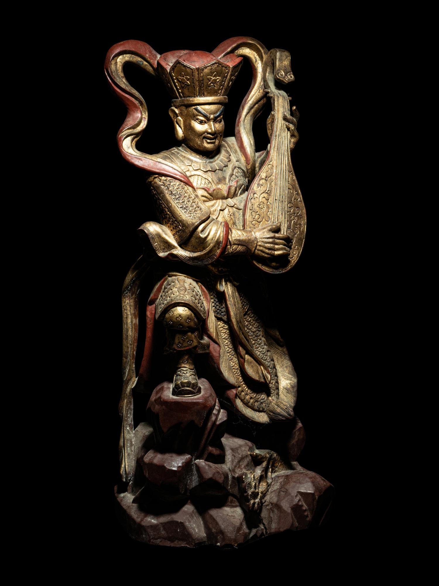 A Set of Four Gilt and Red Lacquered Wood Figures of Guardians
