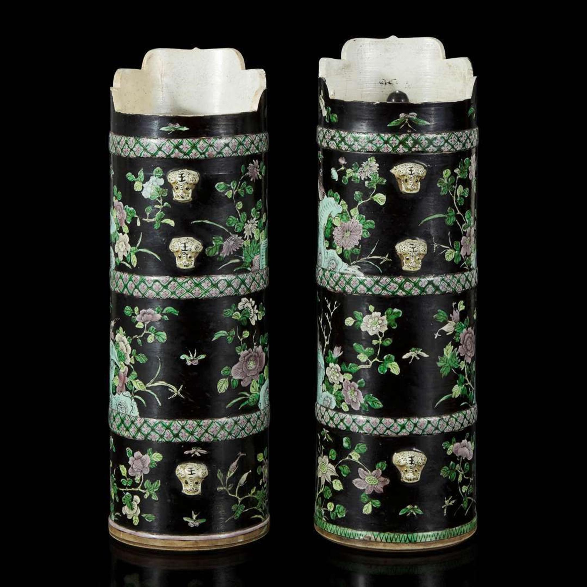 An associated pair of Chinese famille noir-decorated porcelain ceremonial ewers 黑地瓷胎画珐琅多穆壶两只 或为一对 Qing dynasty ?