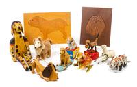 A Group of Eleven Dog Toys depicting Various Breeds Width of widest 10 3/4 inches.