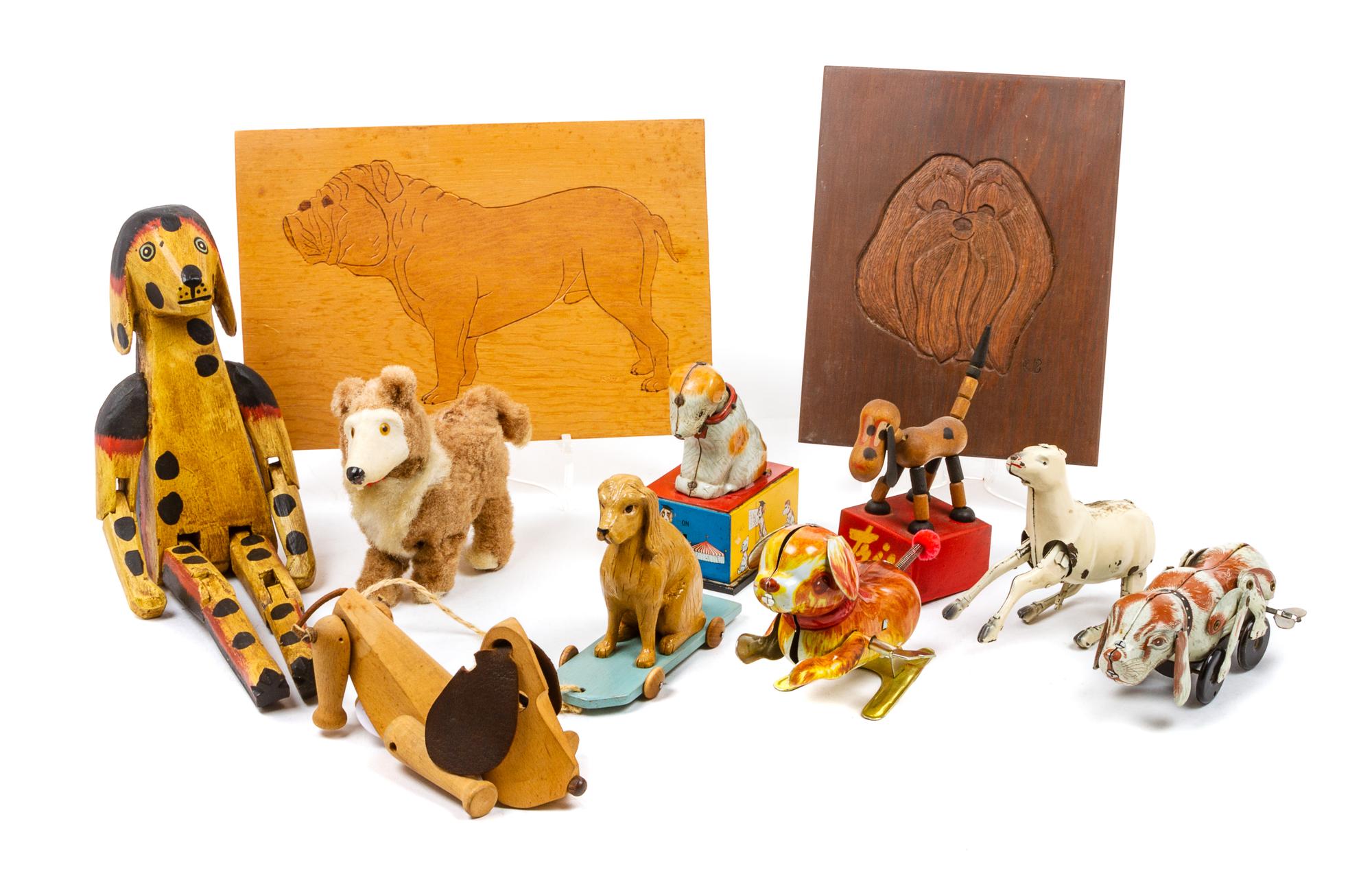 A Group of Eleven Dog Toys depicting Various Breeds Width of widest 10 3/4 inches.